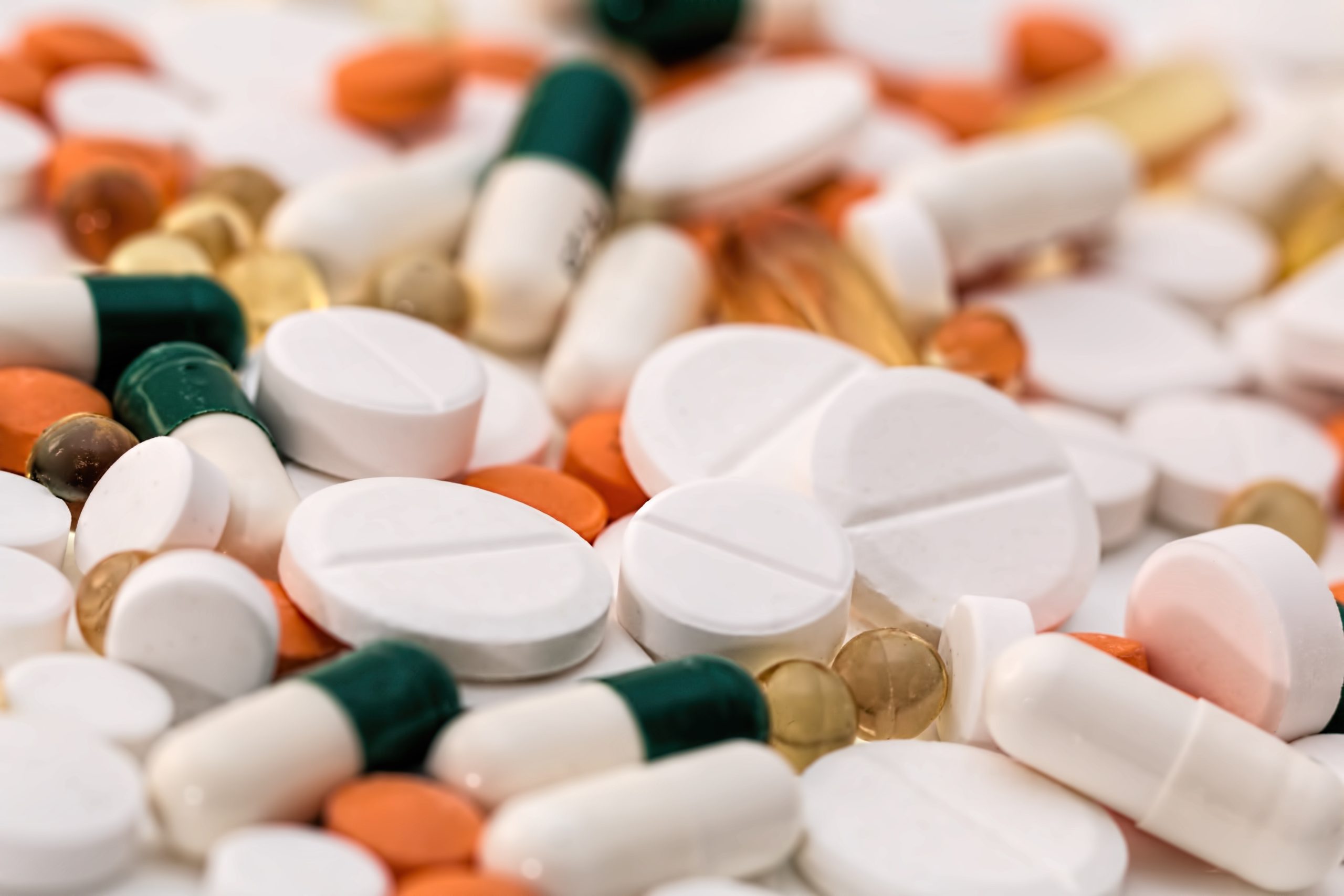 Hashimoto disease medicationsbunch of white oval medication tablets and white medication